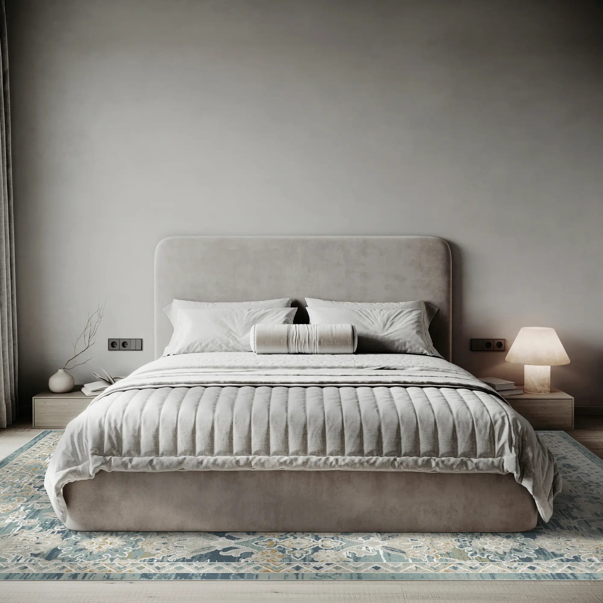 blue area rug with distressed trellis pattern under bed in bedroom setting