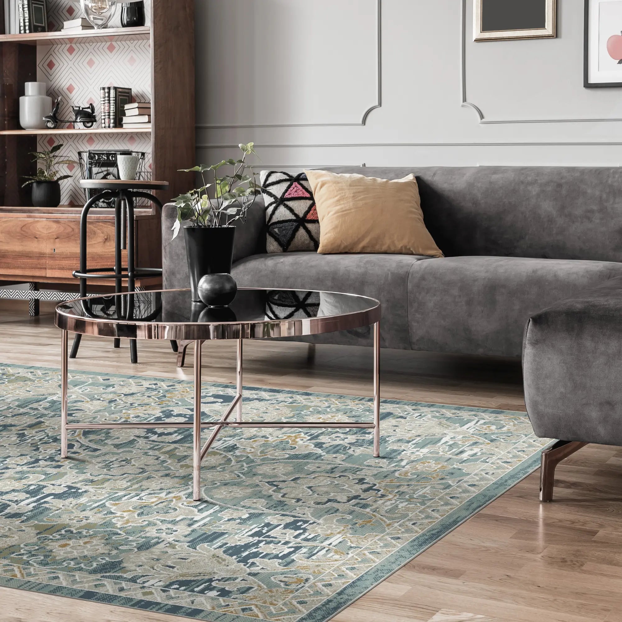 blue area rug with distressed trellis and floral patterns in living room setting