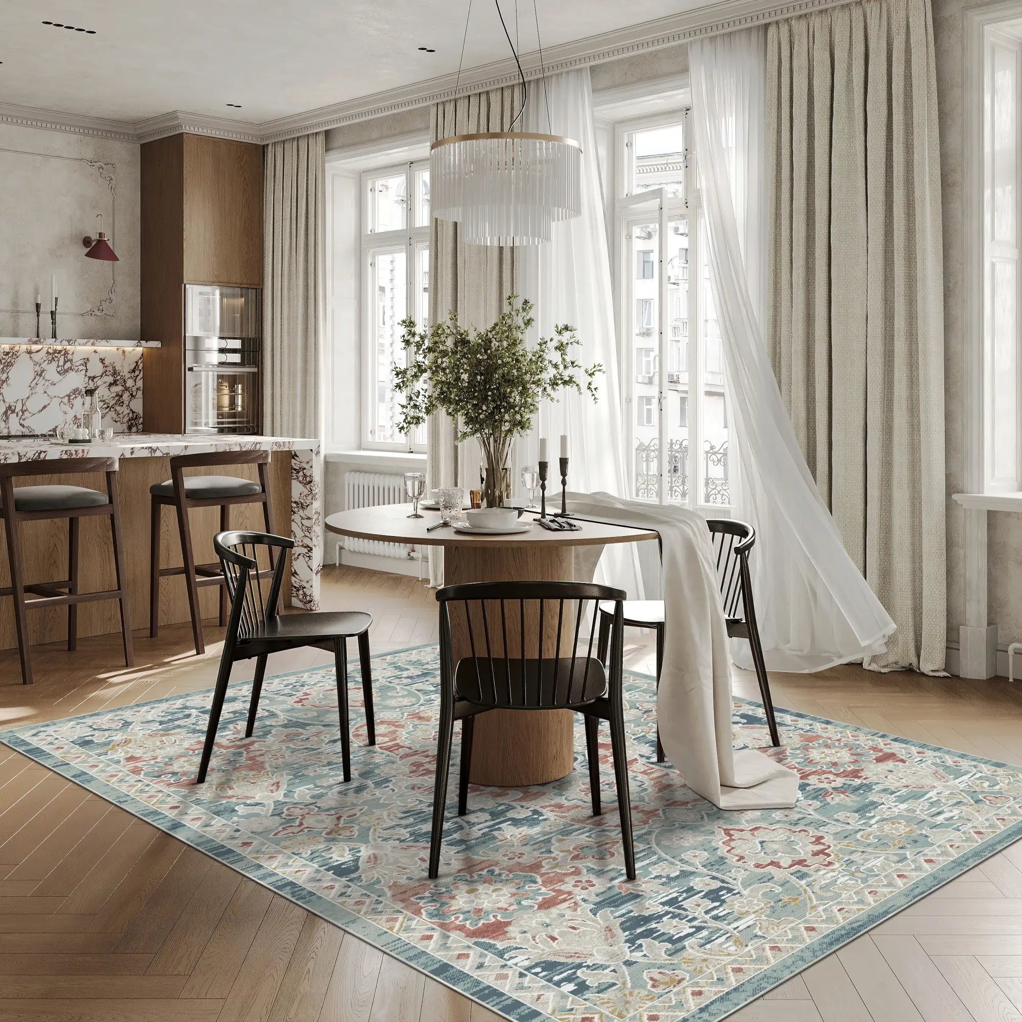 area rug with blue, red, and beige damask pattern under dining table in bright room
