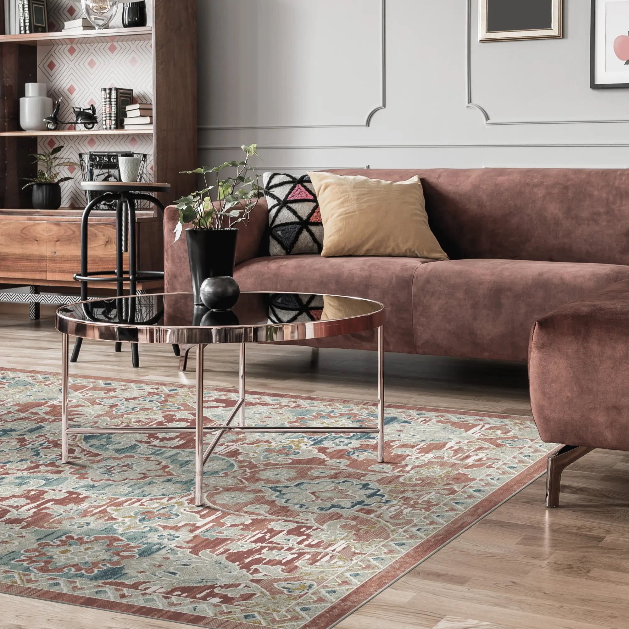 area rug with terracotta, blue, and cream floral trellis pattern in living room setting