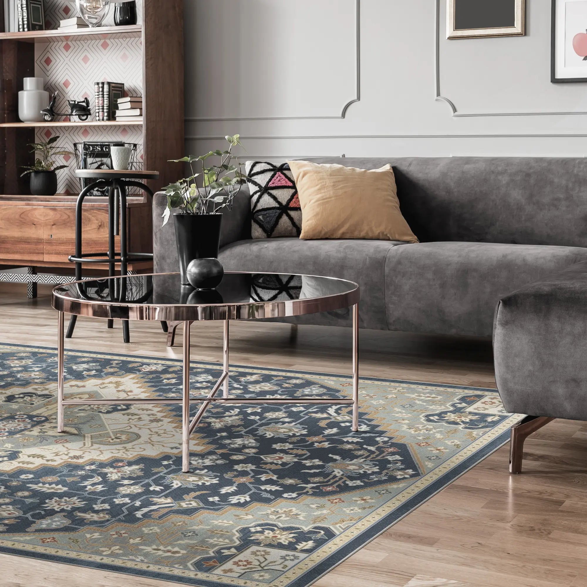 blue and beige area rug with medallion and floral patterns in living room setting