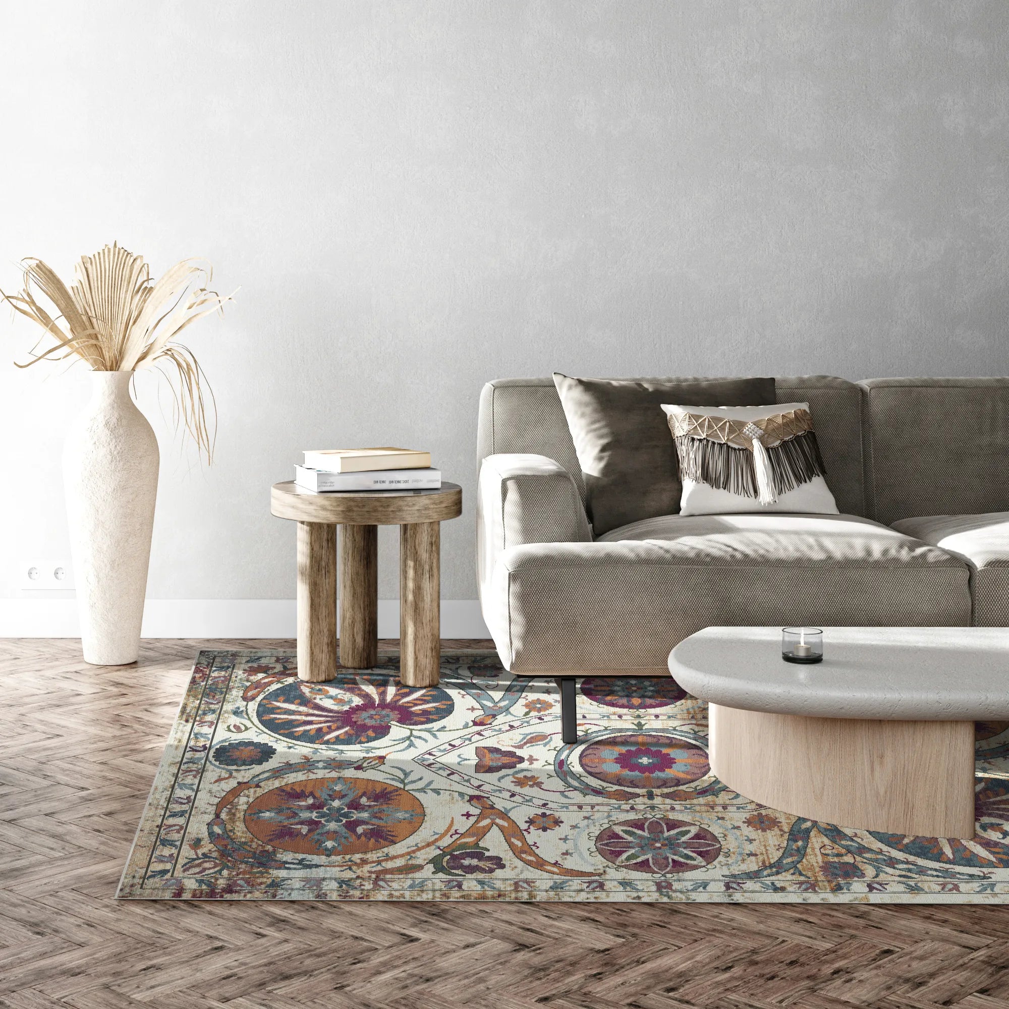 area rug with amber, blue, and purple medallion and floral patterns on light background