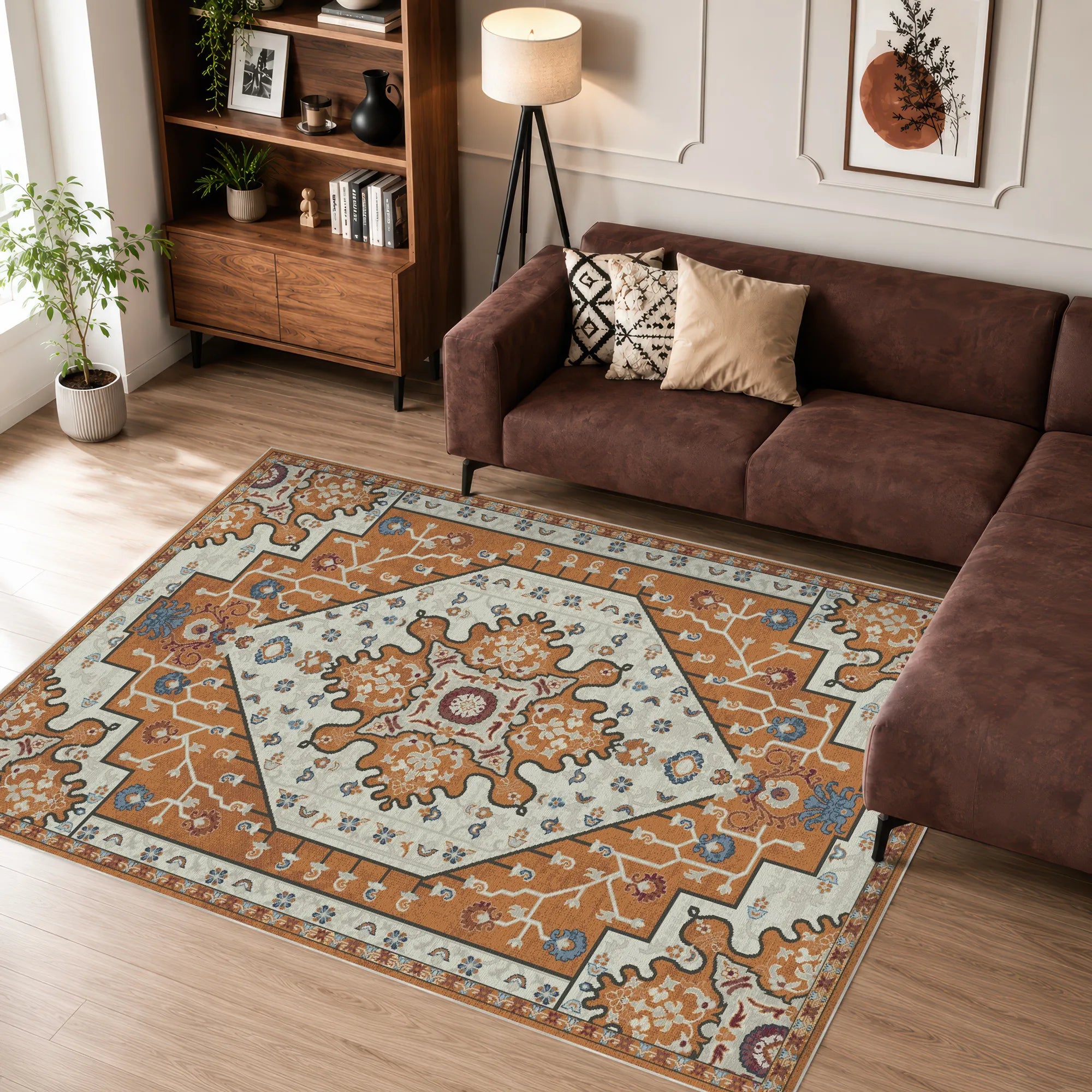 Living room with a brown sofa, patterned rug, and wooden bookshelf.
