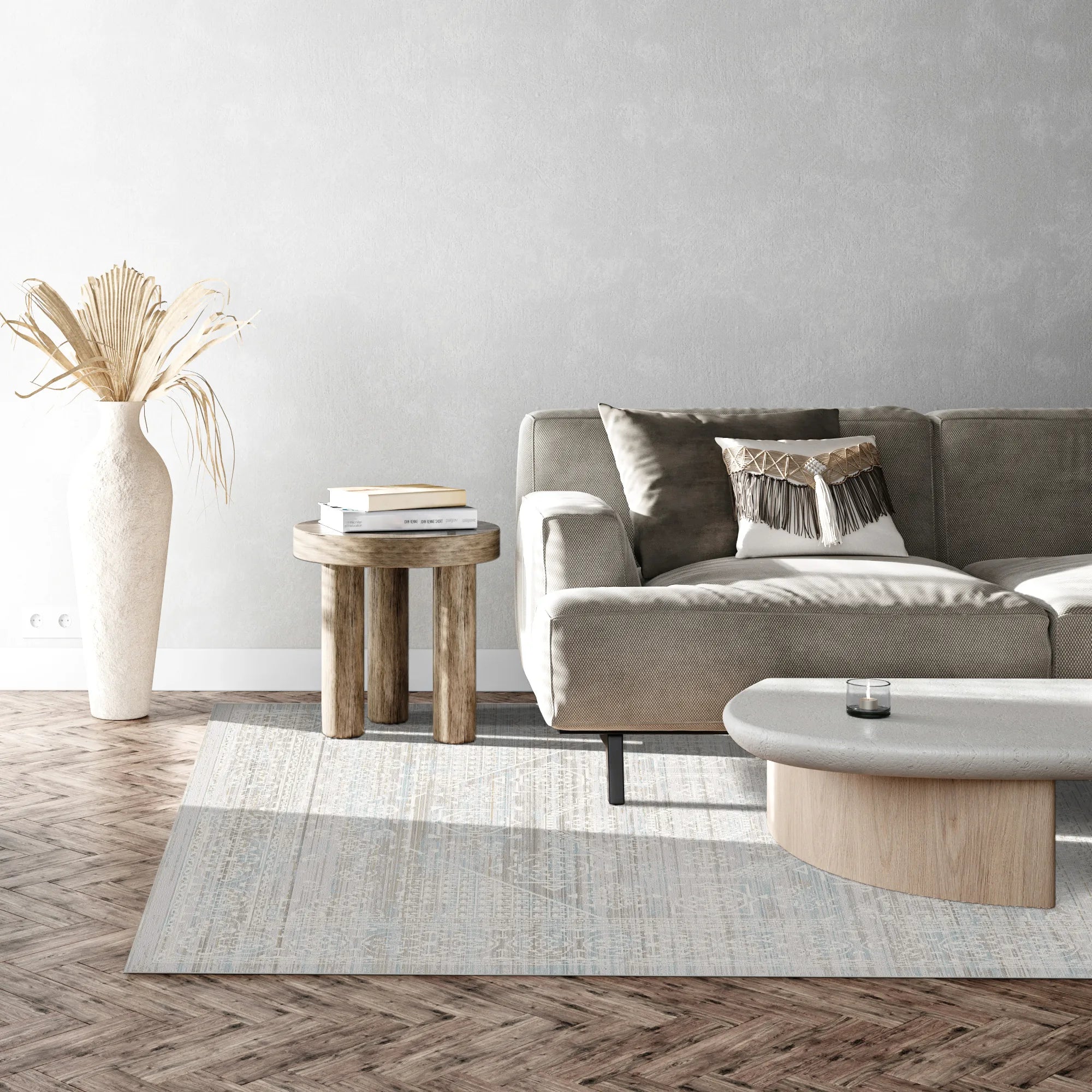 Light blue and beige area rug with subtle geometric pattern in living room setting