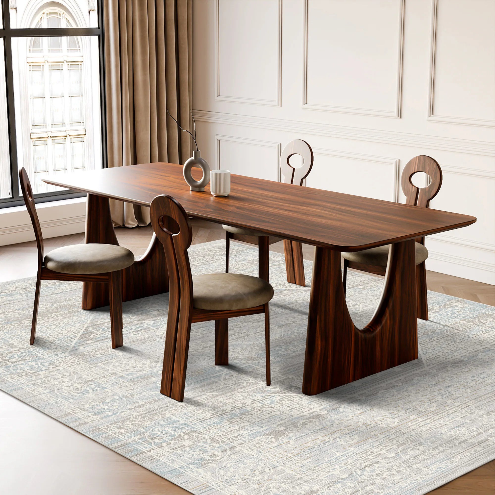 light blue and beige area rug with subtle geometric pattern under dining table