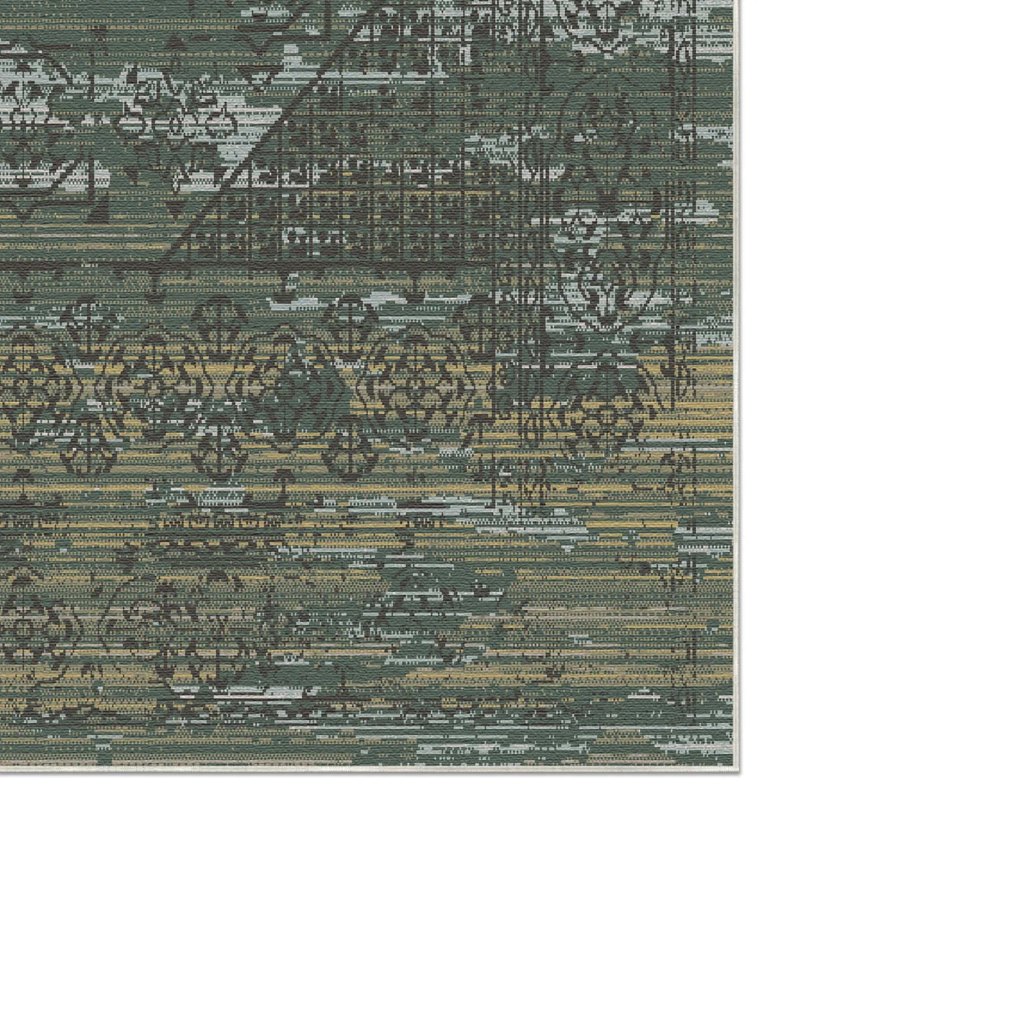 Green and beige area rug with intricate geometric and floral patterns close-up view