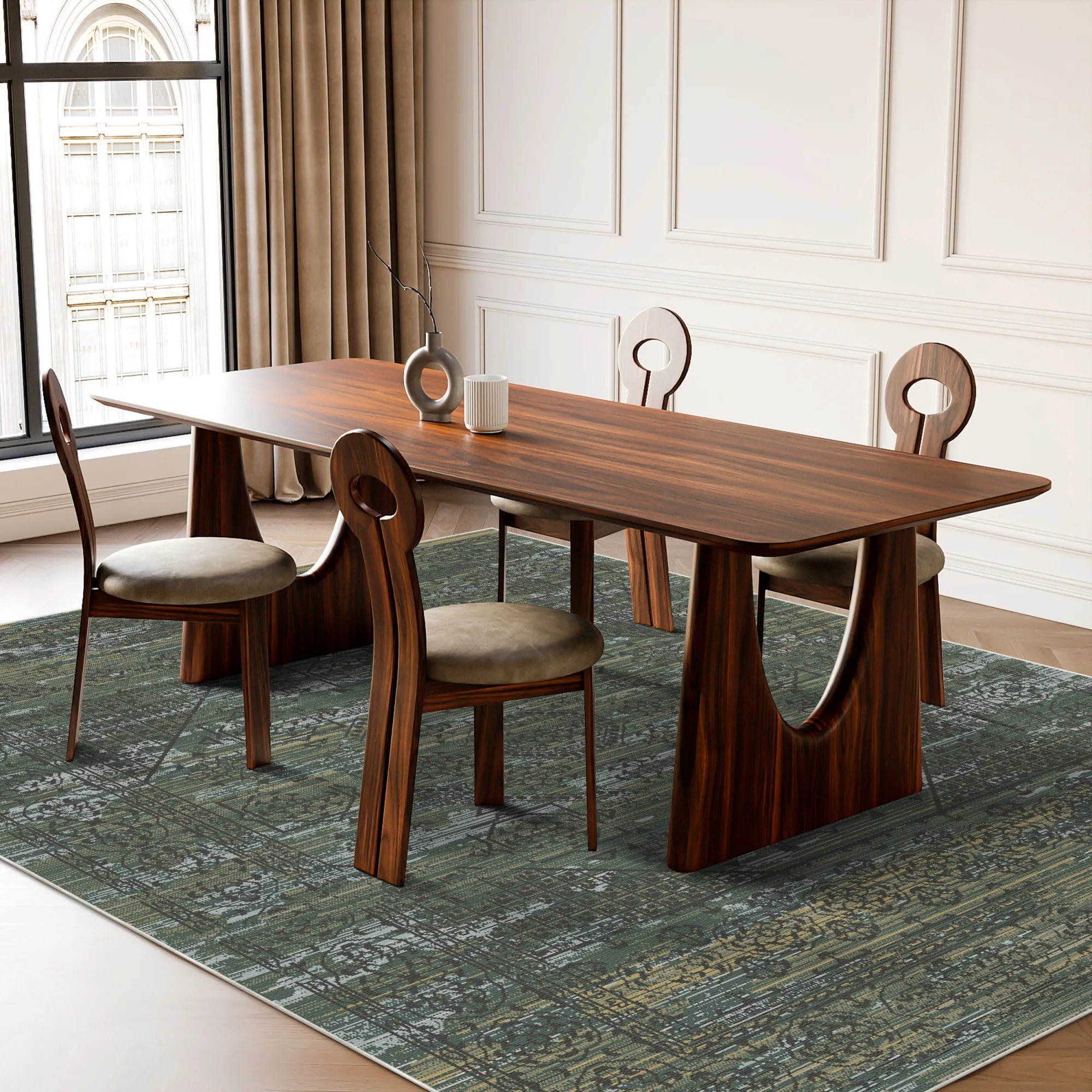 green area rug with abstract geometric pattern under wooden dining table and chairs