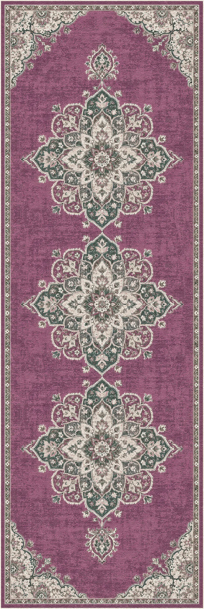 A rectangular area rug with a traditional ornamental pattern in dusty purple, sage green, and cream, shown flat against a white background.