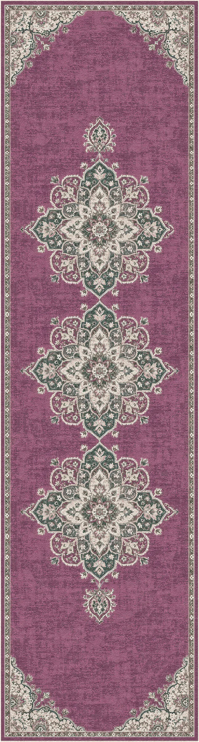 A rectangular area rug with a traditional ornamental medallion pattern in dusty purple, beige, and sage green, shown flat against a white background.