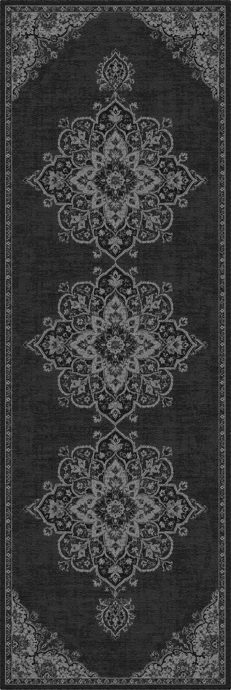 A dark charcoal gray area rug featuring a traditional ornate medallion pattern in light gray and white, with a matching patterned border.