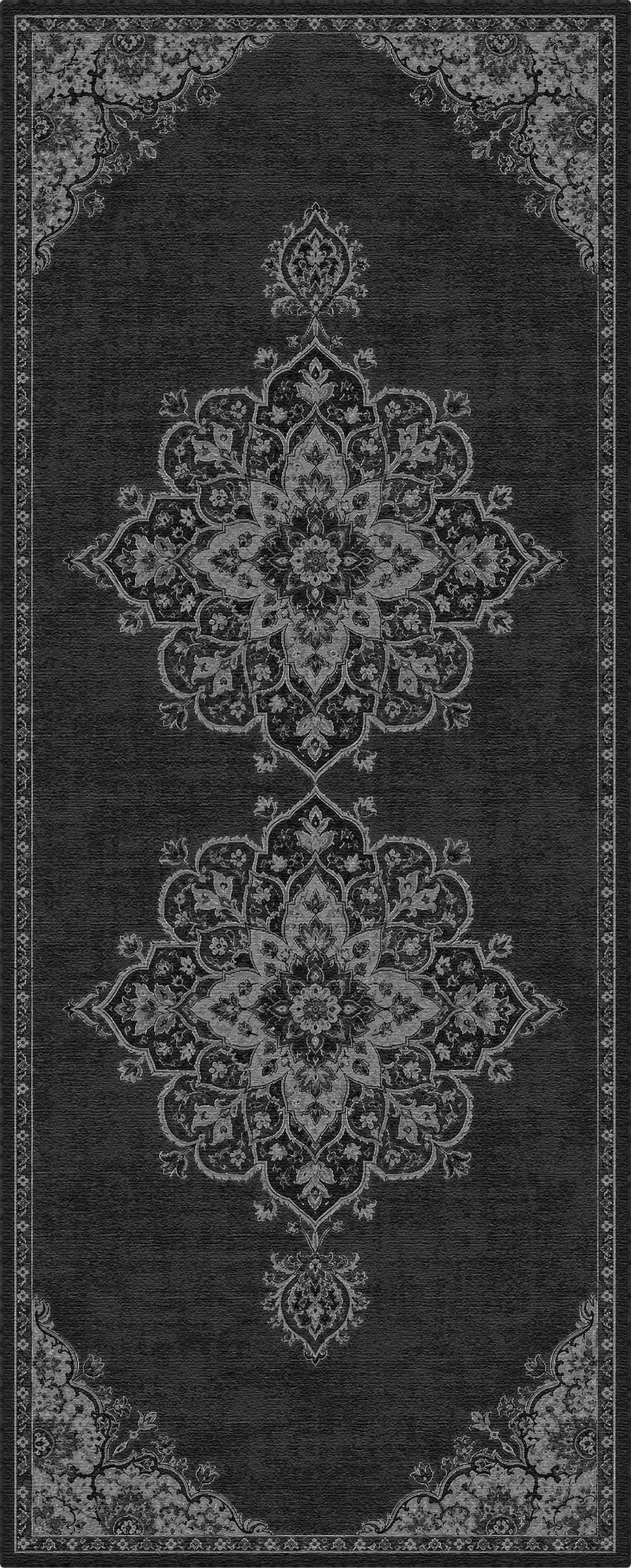 A dark charcoal gray area rug with a distressed, vintage-style traditional pattern in light gray and white, featuring two large central medallions and ornate corner details.