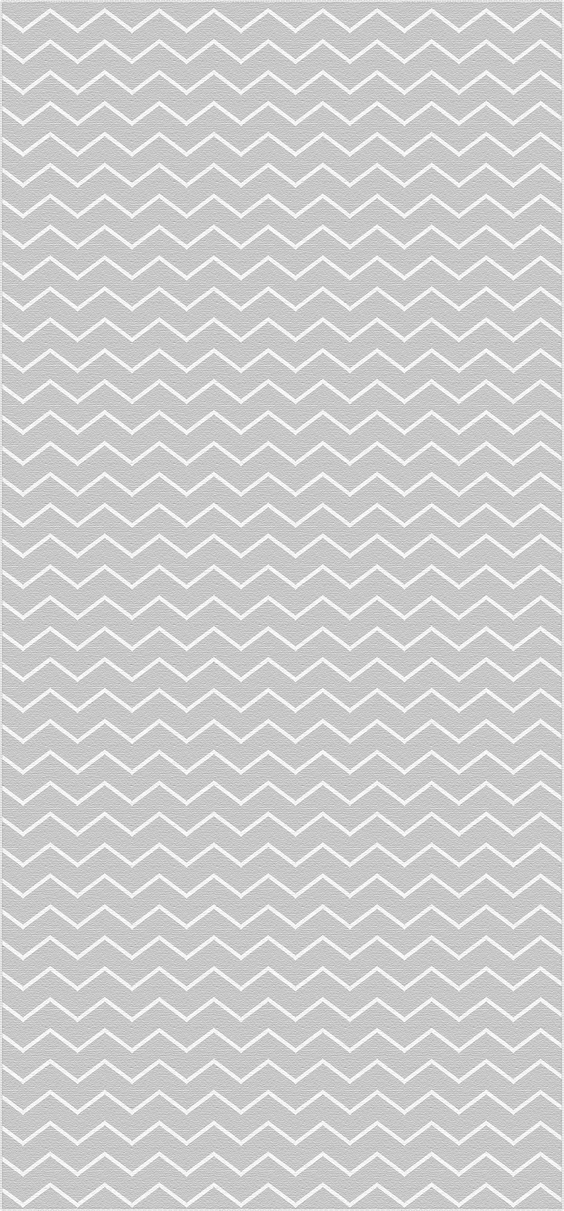 Gray area rug with white chevron zigzag pattern