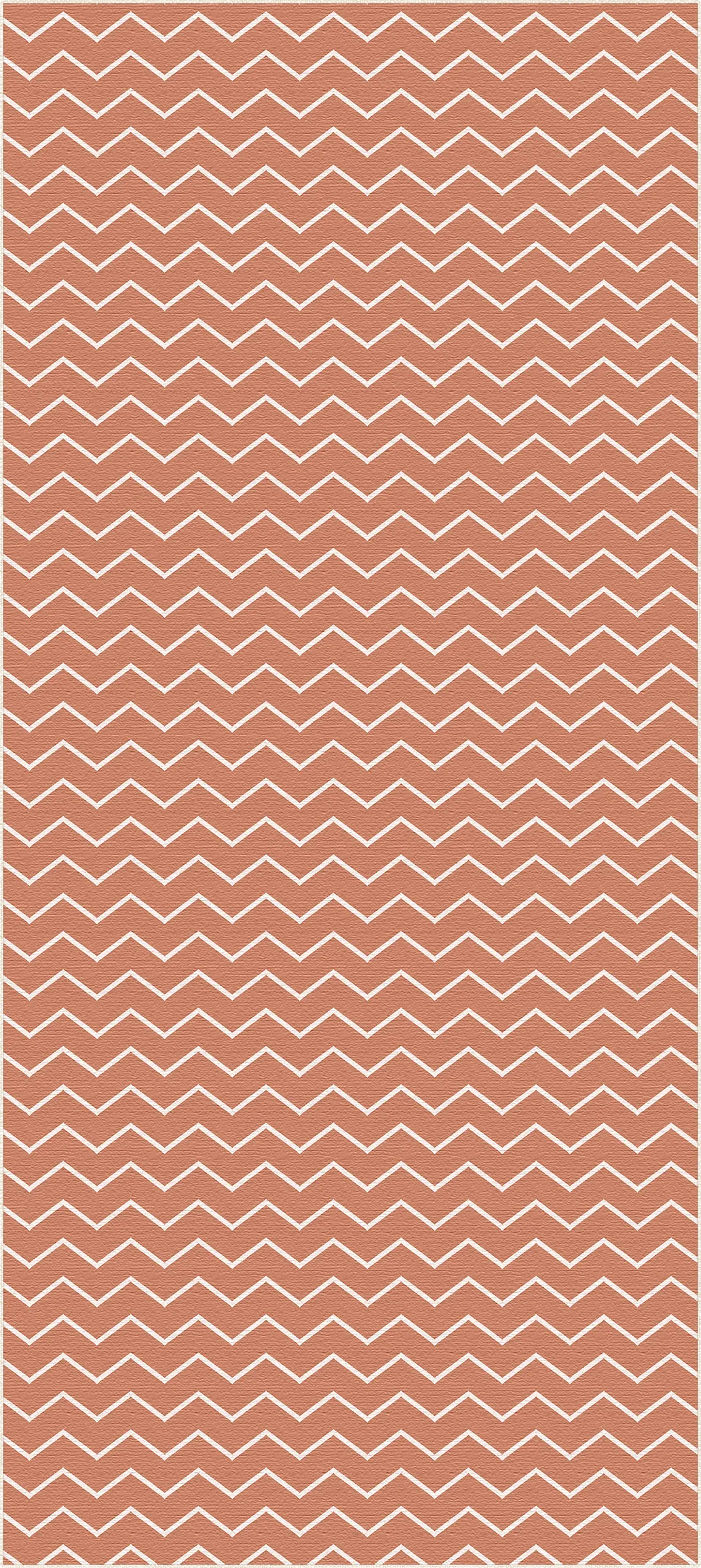 area rug with terracotta background and white chevron zigzag pattern