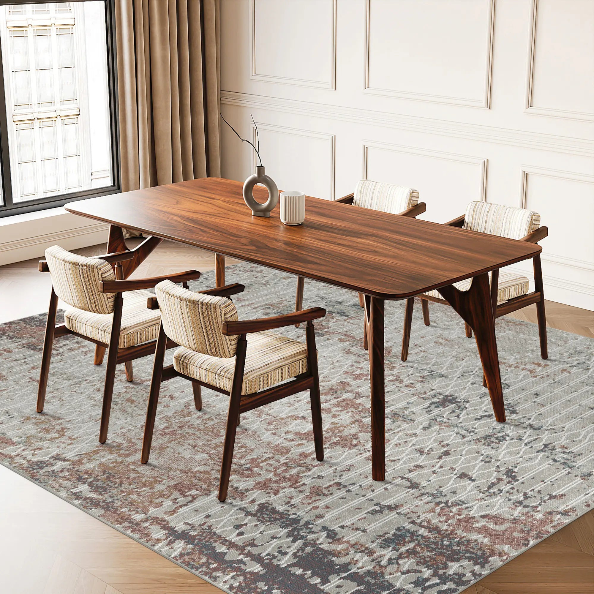 area rug with rust, gray, and cream abstract lattice pattern under dining table and chairs