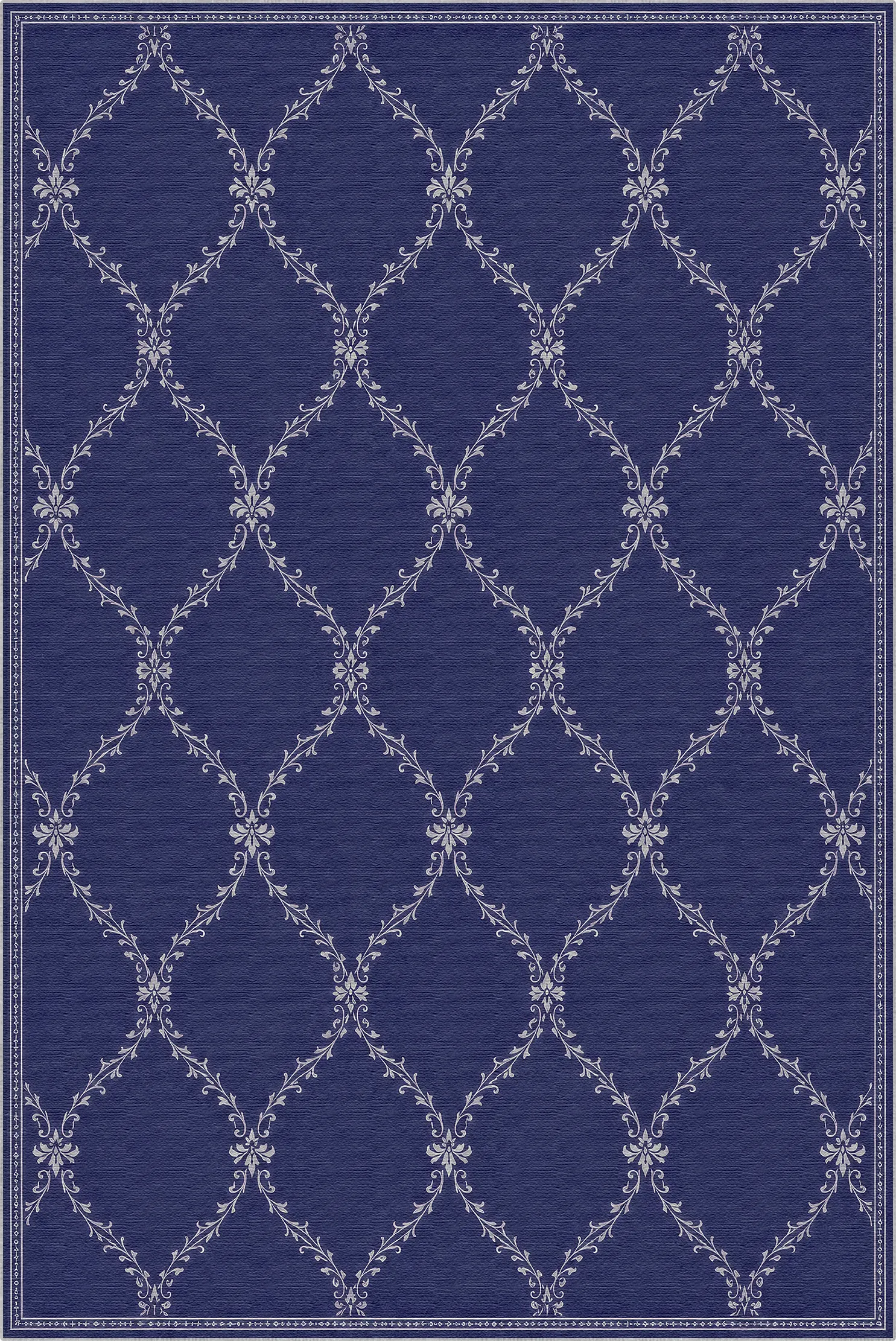 A lattice area rug with a deep navy blue background and a repeating white trellis pattern with floral accents at the intersections.