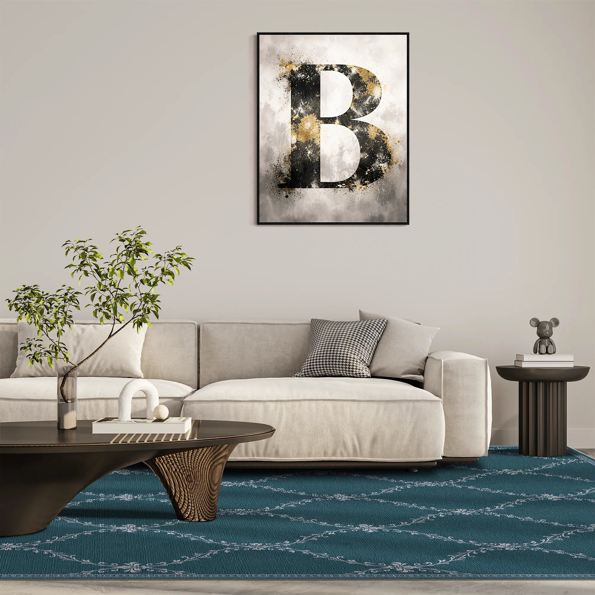 A lattice teal area rug with a framed abstract wall art print featuring a large textured letter 'B' in black, white, and gold tones, displayed above a modern light beige sofa in a styled living room setting.