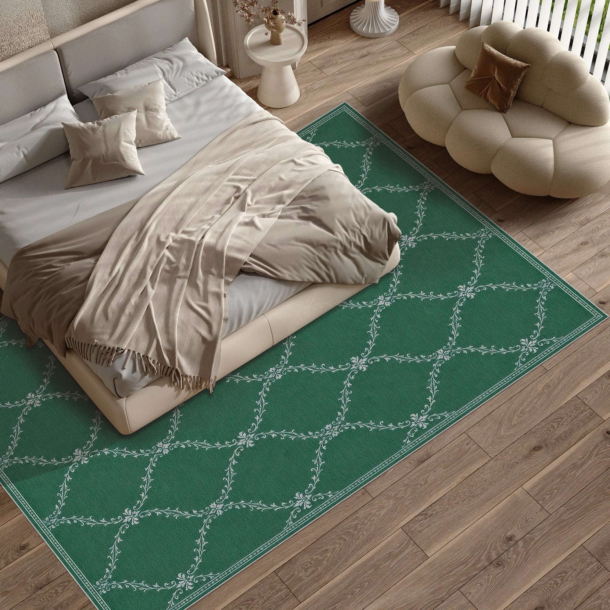 A green lattice washable area rug with a white trellis pattern shown in a styled bedroom setting next to a bed and a modern cloud-shaped pouf.